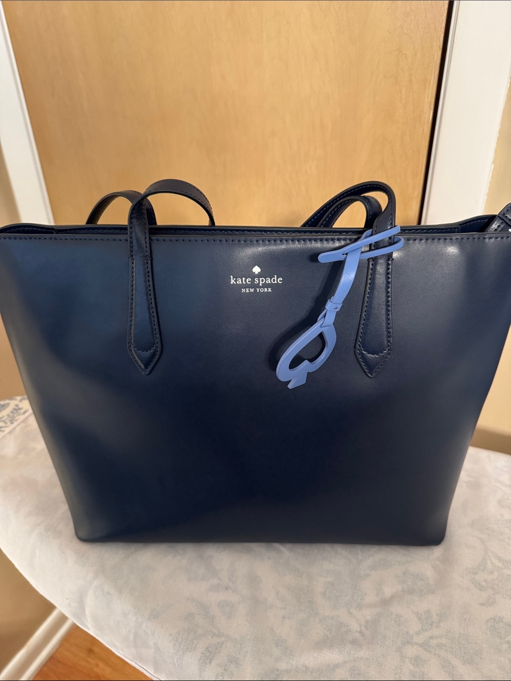 kate spade navy leather tote with light blue charm
